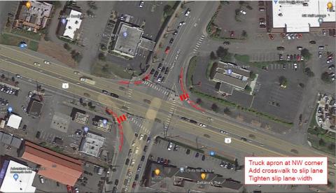 An overhead photo with red lines showing where a truck apron will be built in the northwest corner of US 2 and Chain Lake Road. It also shows where crosswalks will be built at the northeast and southwest corners of the intersection.