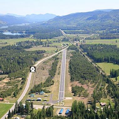 Ione Airport Runway located around trees and grass.