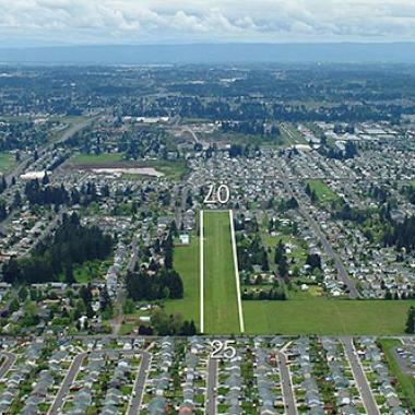 Fly For Fun Airport Runway located on flat grassland near the city center.