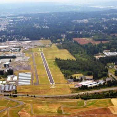 Thun Field Airport Runway located on flat grasslands.