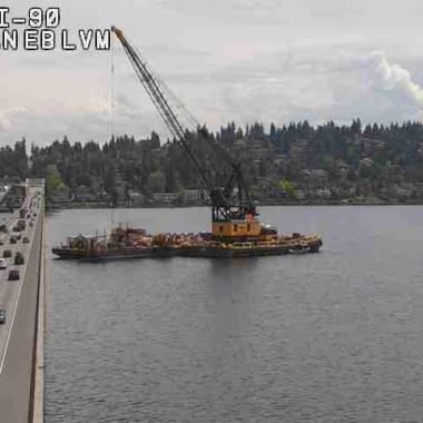 Photo of the barge with large crane on it doing anchor cable replacements