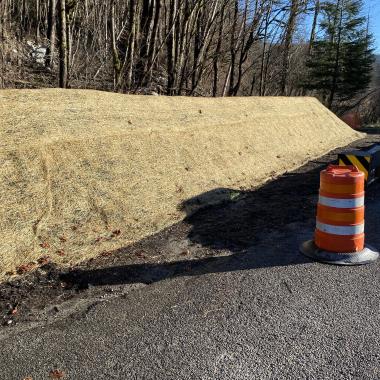 Completed earthen berm along US 2 near Skykomish.