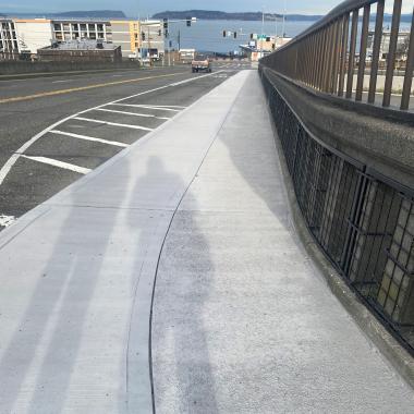 Widened sidewalk along northbound State Route 525 in Mukilteo looking toward water.