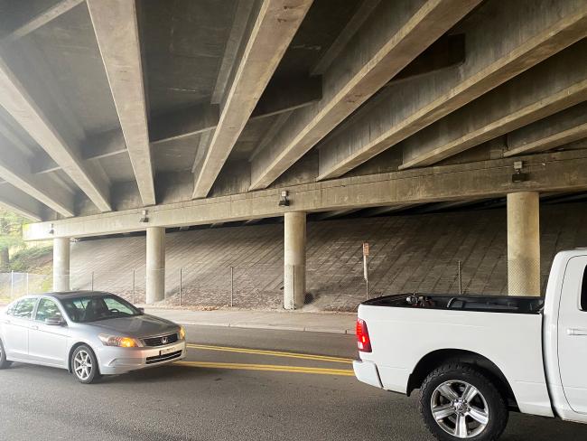 Photo sows four columns supporting the SR overpass over East Casino Road in Everett. Cars pass under the bridge in the foreground.